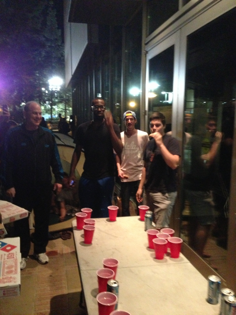 Illustration for article titled Here's A Photo Of UCLA Head Coach Ben Howland, In A Tracksuit, Playing Beer Pong With Students Last Night